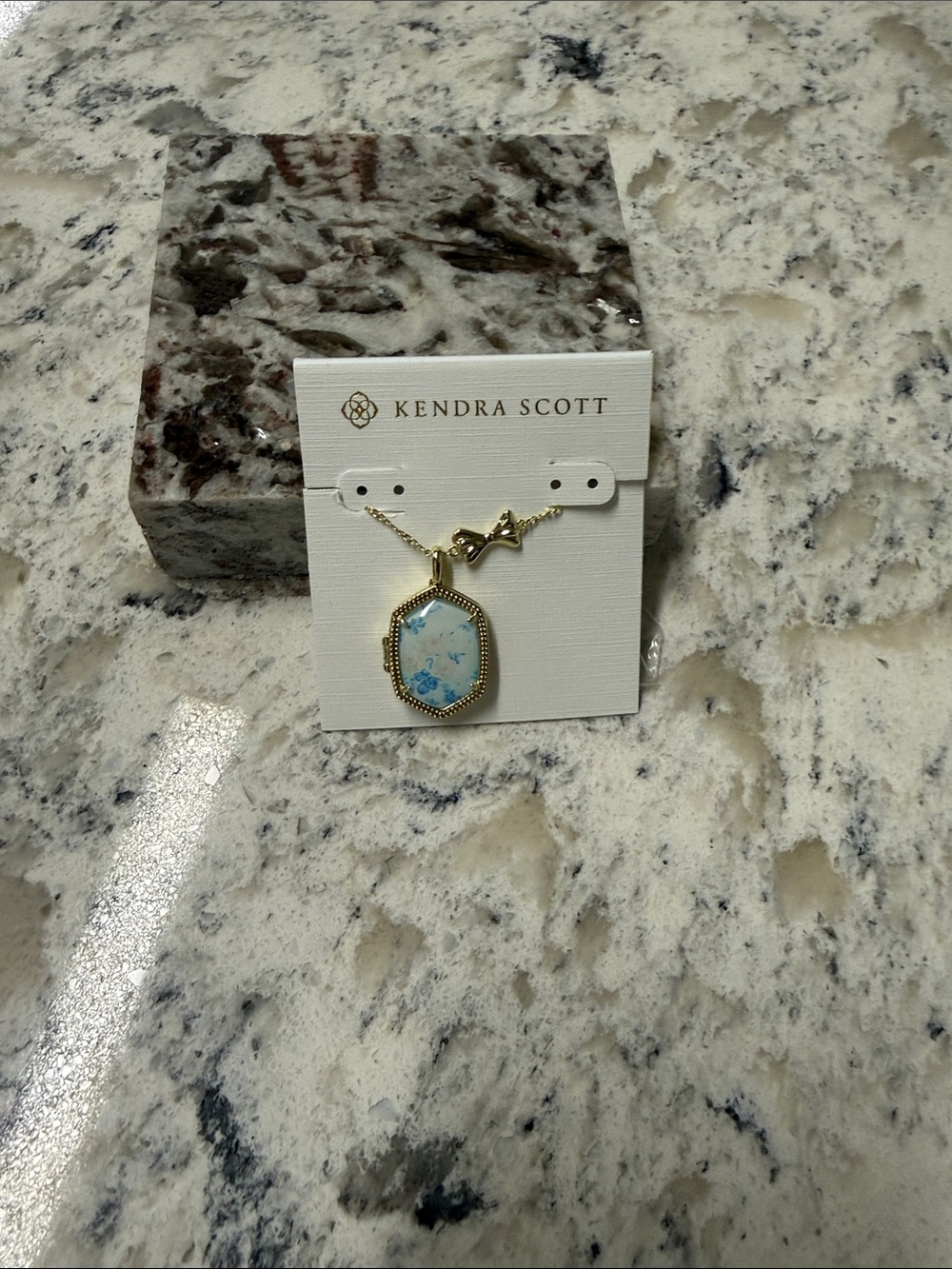 Kendra Scott Gold Necklace with Blue and White colored locket
